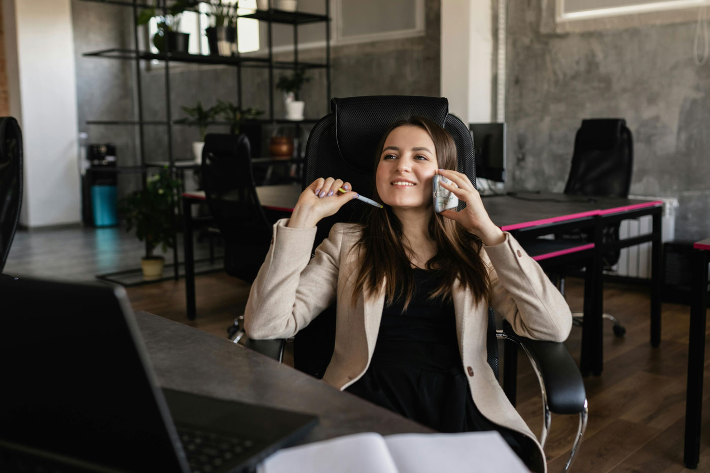 Young professional on a quick phone call in office, representing superficial recruitment shortcuts