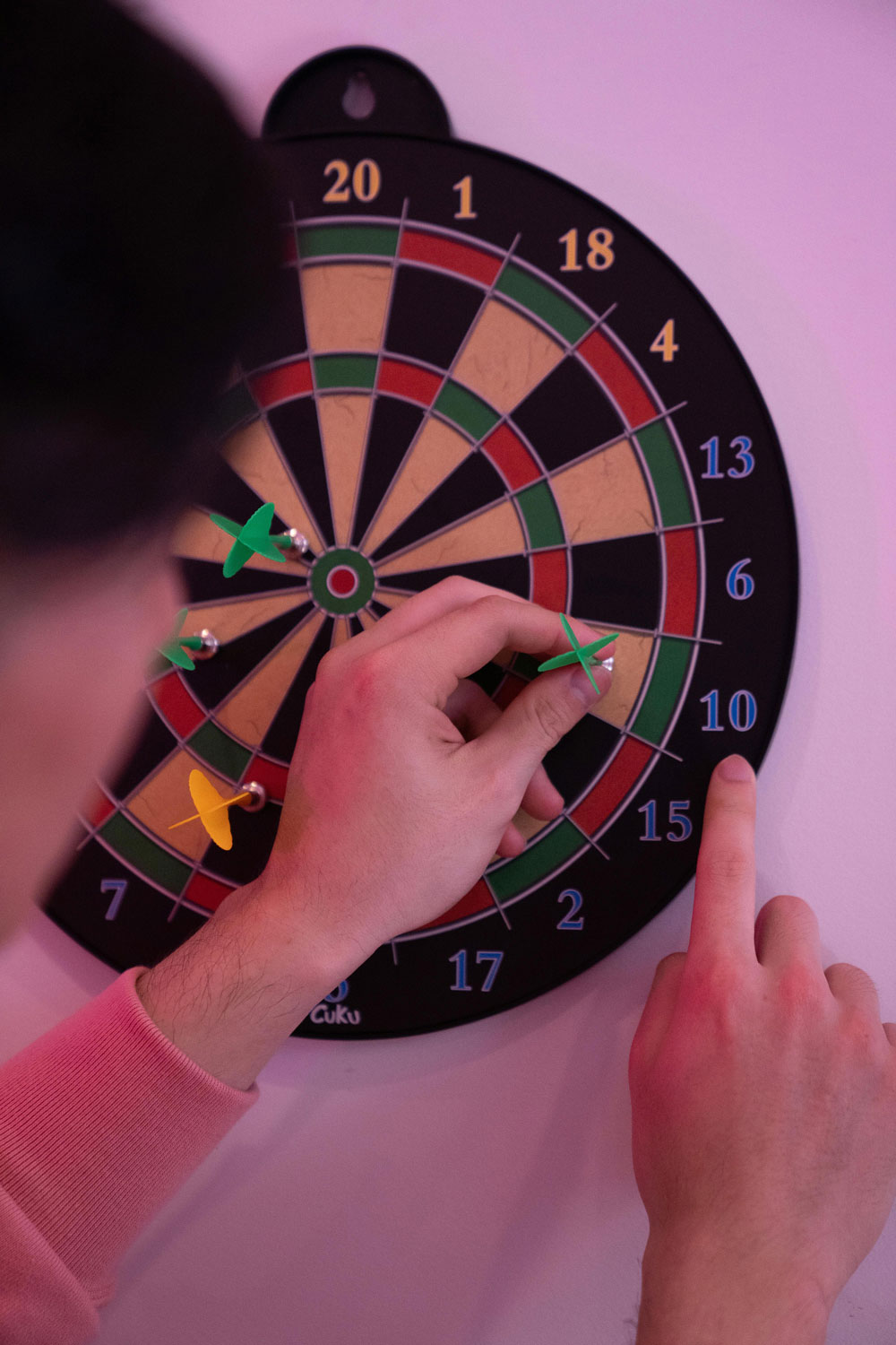 Close-up of darts on a dartboard symbolising careless recruitment practices