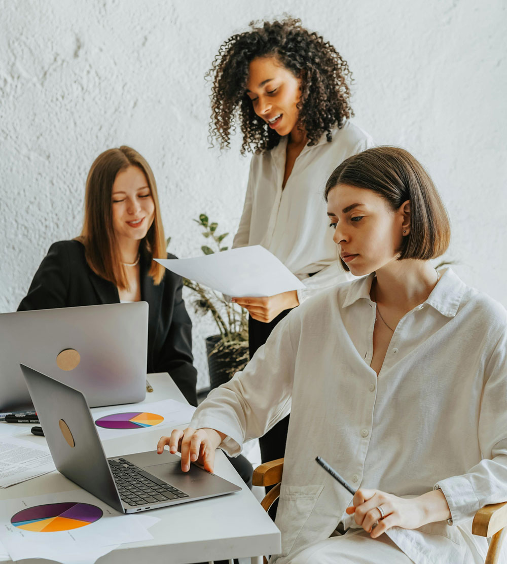 Group of consultants collaborating on candidate review in office setting