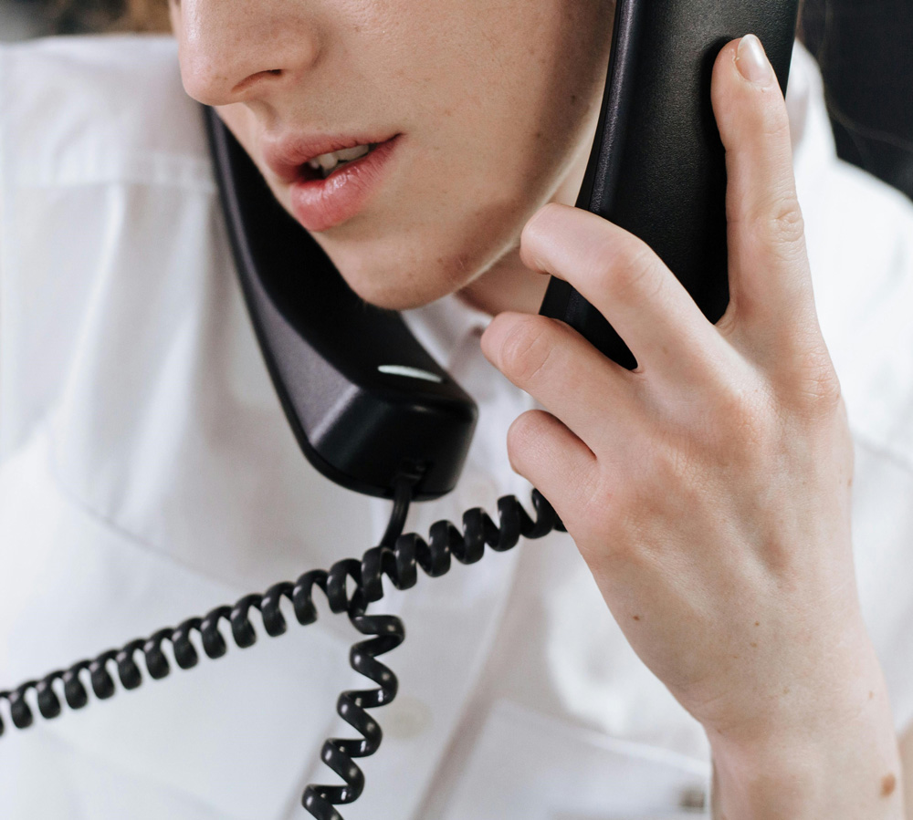 Close-up of a person on the phone representing rushed screening calls in recruitment