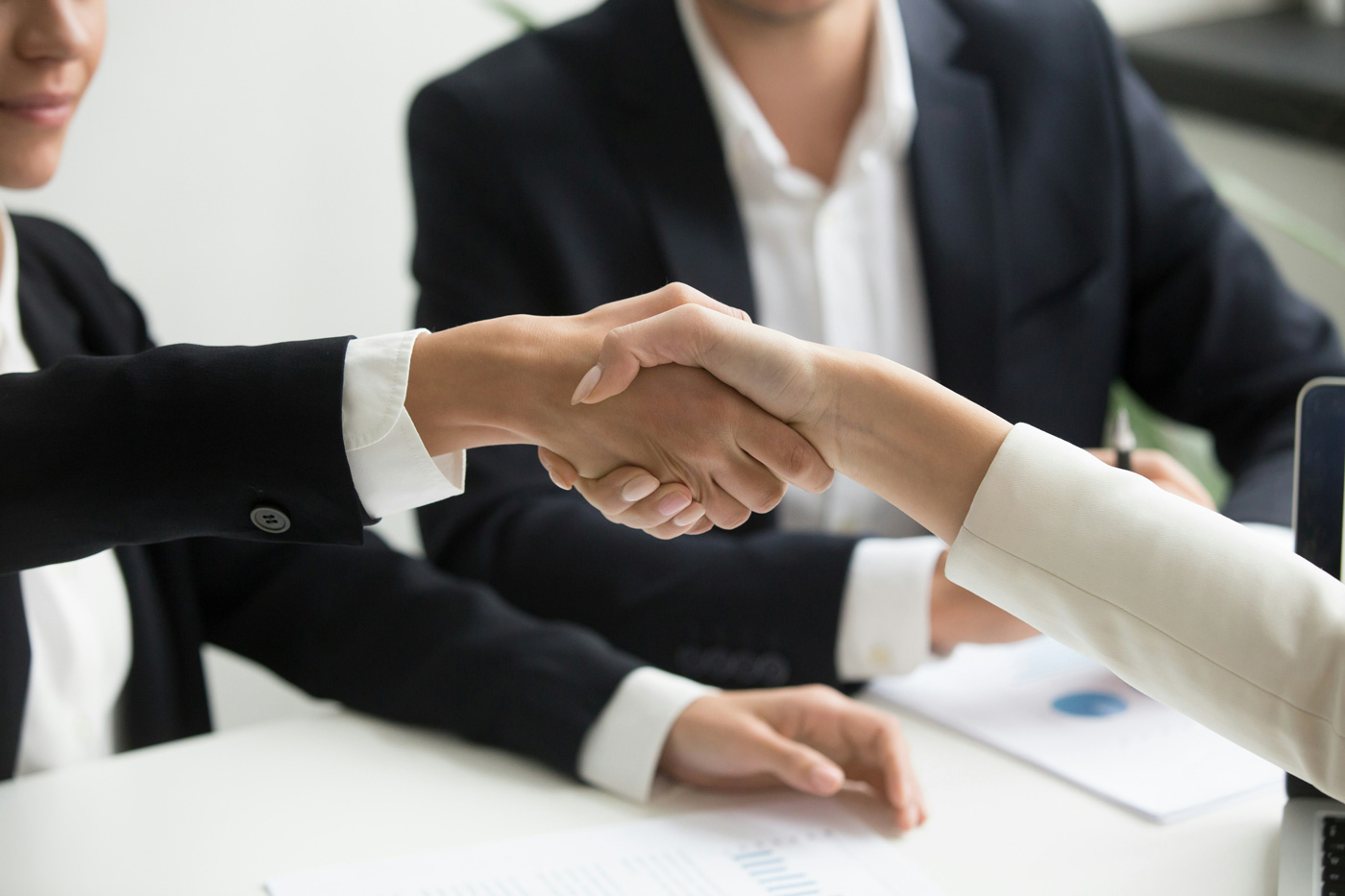 Professional handshake representing the transition from AI screening to a real interview