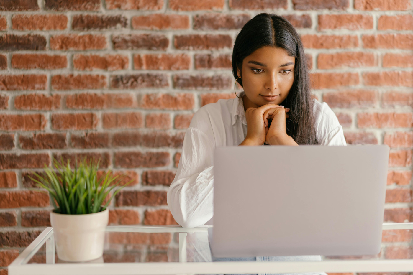 Candidate preparing for an online AI interview on a laptop